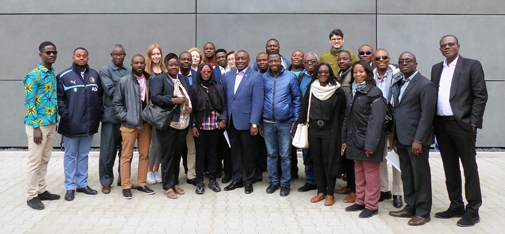 Group picture of the civil engineers, planners, contractors and construction industry representatives from Ghana after the factory tour in front of the new main building of MC-Bauchemie in Bottrop.